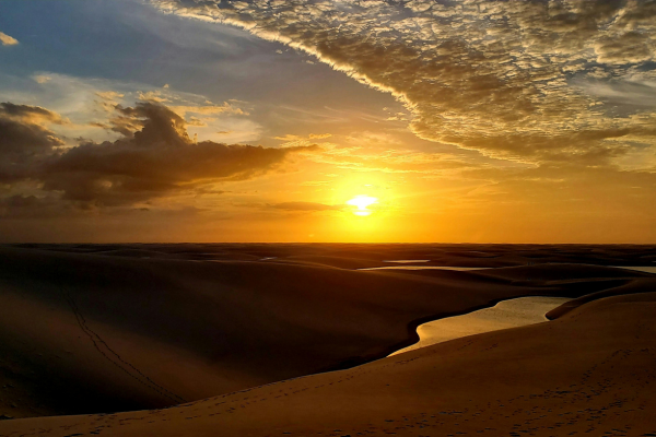 Sunset over the dunes of Lençóis Maranhenses in Barreirinhas, Maranhão, Brazil.