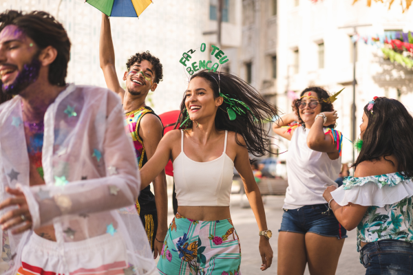 Group of friends in Carnival costumes