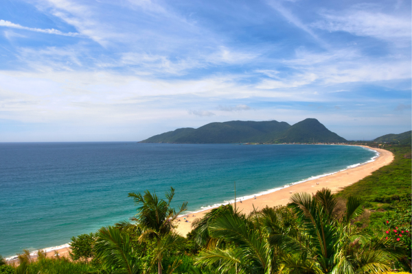 long beach with mountains in florianopolis, brazil