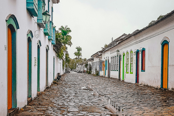 Colonial cobblestone street with colorful doors in Paraty historic center, Rio de Janeiro state, Brazil